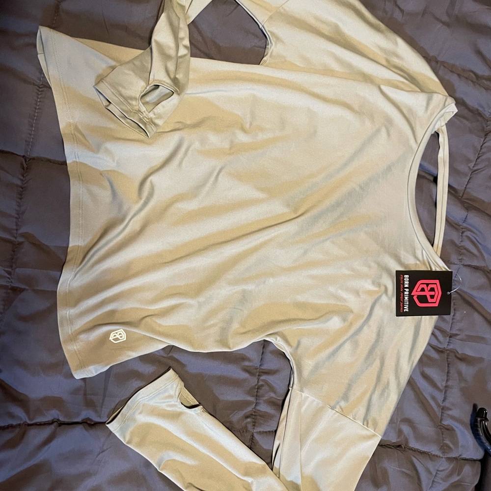 NWT Born Primitive long sleeve shirt with open-back design